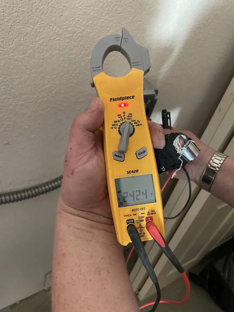Voltage testing with clamp meter during Recessed Lighting Installation in Gillette